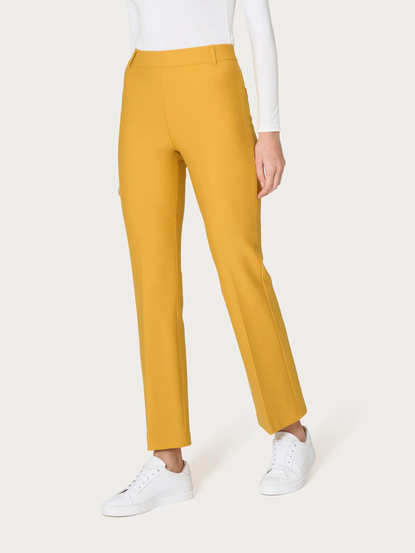 Pantalone flare alla caviglia in Compact - Golden Spice